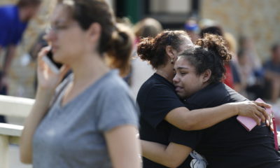 Santa Fe High School junior Guadalupe Sanchez cries in the arms of her mother, Elida Sanchez.