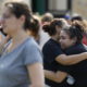 Santa Fe High School junior Guadalupe Sanchez cries in the arms of her mother, Elida Sanchez.