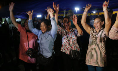 Photo of people celebrating the rescue of some of the boys from the Thai soccer team
