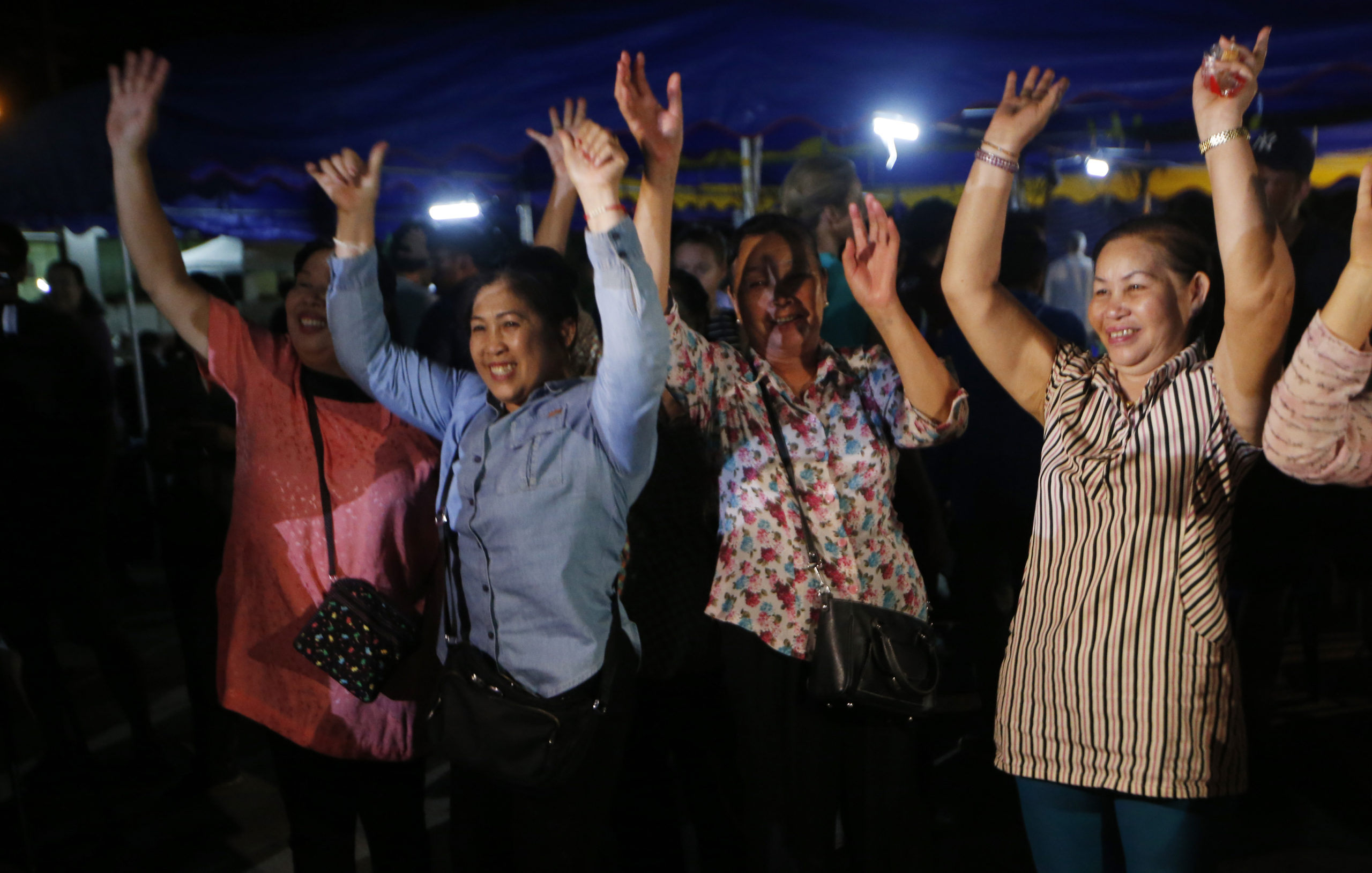 Photo of people celebrating the rescue of some of the boys from the Thai soccer team