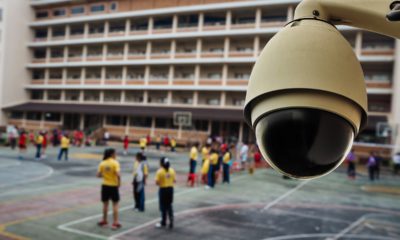 Photo of a security camera overlooking a school play yard
