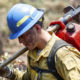 Photo of a "hot shot" firefighter carrying his gear