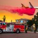 Photo of a plane dropping fire retardant