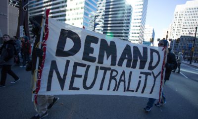 Photo of protestors advocating for net neutrality