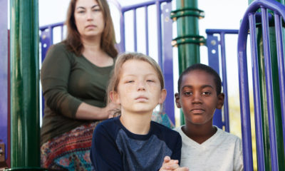 Shutterstock Photo of a mother with her daughter and a foster ston