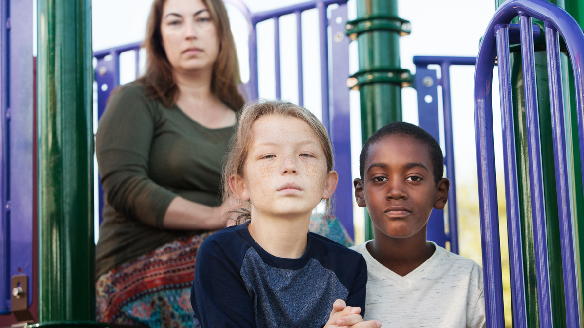 Shutterstock Photo of a mother with her daughter and a foster ston