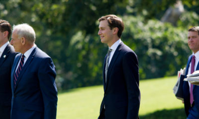 Photo of Jared Kushner walking on lawn