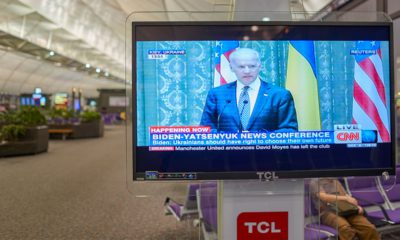 Photo of an airport TV airing CNN News