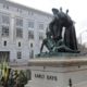 Photo of "Early Days" - a statue that depicts a Native American at the feet of a Spanish cowboy and Catholic missionary in San Francisco.