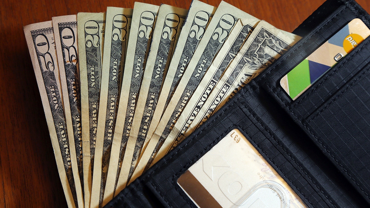 Photo of cash and a wallet