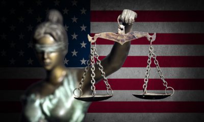 Photo of lady justice and flag background