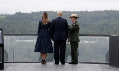 President Donald Trump and first lady Melania Trump walking along the September 11th Flight 93 memorial