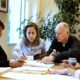 Photo of Gov. Jerry Brown reviewing a measure with his wife