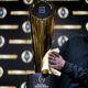 Photo of Charley Green buffing the NCAA college football championship trophy