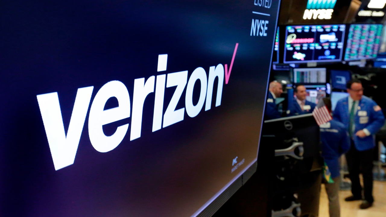 Photo of the logo for Verizon above a trading post on the floor of the New York Stock Exchange