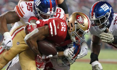Photo of San Francisco 49ers running back Matt Breida being tackled