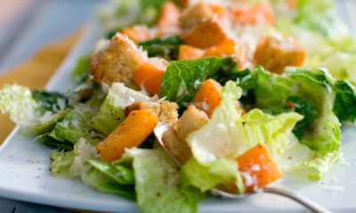 Photo of a caesar salad with romaine lettuce