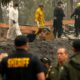 Photo of investigators recovering human remains