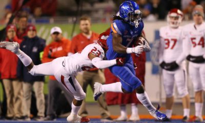 Photo of a Fresno State player tackling a Boise State player