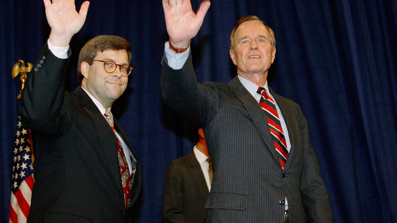 Photo of President George H.W Bush, right, and William Barr