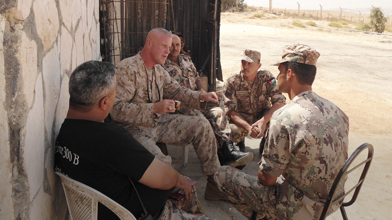 Photo of Marine officer Terry Slatic with his troops in Afghanistan