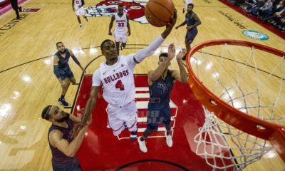 Photo of Braxton Huggins driving for a layup vs. Nevada