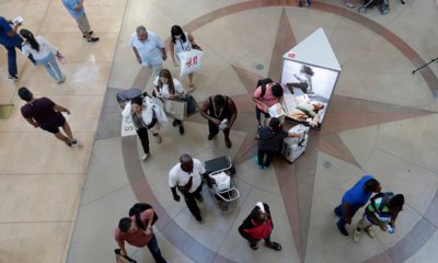 Photo of shoppers walking through a mall