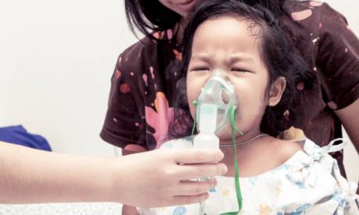 Photo of child with inhaler mask
