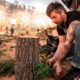 Photo of a worker putting final touches on diorama