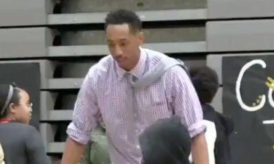 Photo of Jonathan Clark getting ready to slam dunk in a shirt and tie