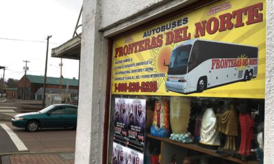Photo of sign advertising bus trips to California with connections to Mexico