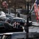 Photo of Secret Service Agents stand by the limo of VP Mike Pence