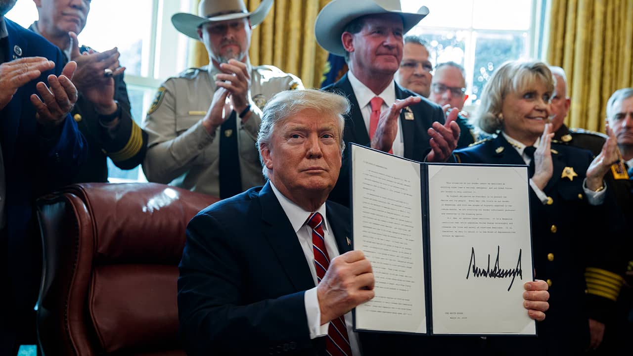 Photo of President Donald Trump after signing his first veto in the Oval Office