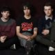 Photo of Braeden Lemasters, left, Cole Preston, center, and Dylan Minnette of the indie rock band Wallows