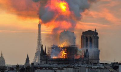 Flames and smoke rise from the blaze at Notre Dame cathedral in Paris on Monday.