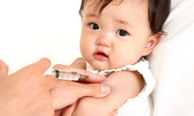 Young child receiving vaccination.