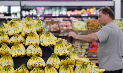 Photo of consumer shopping for bananas