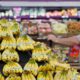 Photo of consumer shopping for bananas