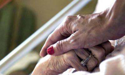 Hand in hand symbolizing hospice care