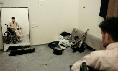 Photo of Anas al-Sarrari sitting in a wheelchair in Yemen