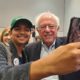 Photo of man snapping a photo with Sen. Bernie Sanders