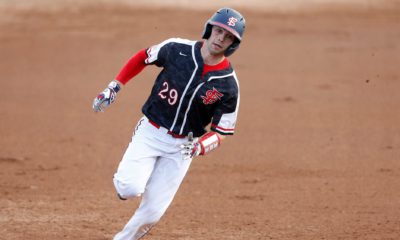Photo of Fresno State catcher Carter Bins rounding the bases