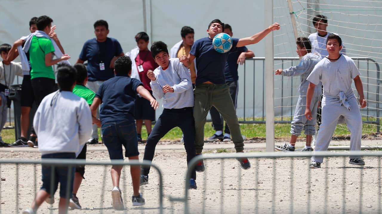 Photo of immigrant children playing soccer