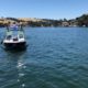 Photo of search boat looking for pilot and plane that sank at Lake Tulloch
