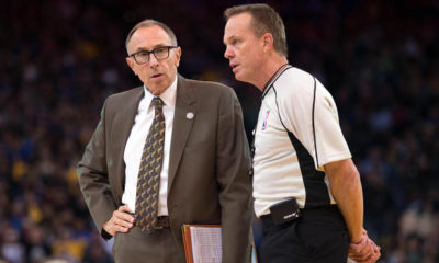 Photo of Golden State Warriors assistant coach Ron Adams and an NBA referee