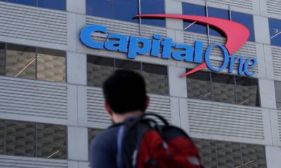 Photo of person standing in front of a Capitol One building in San Francisco