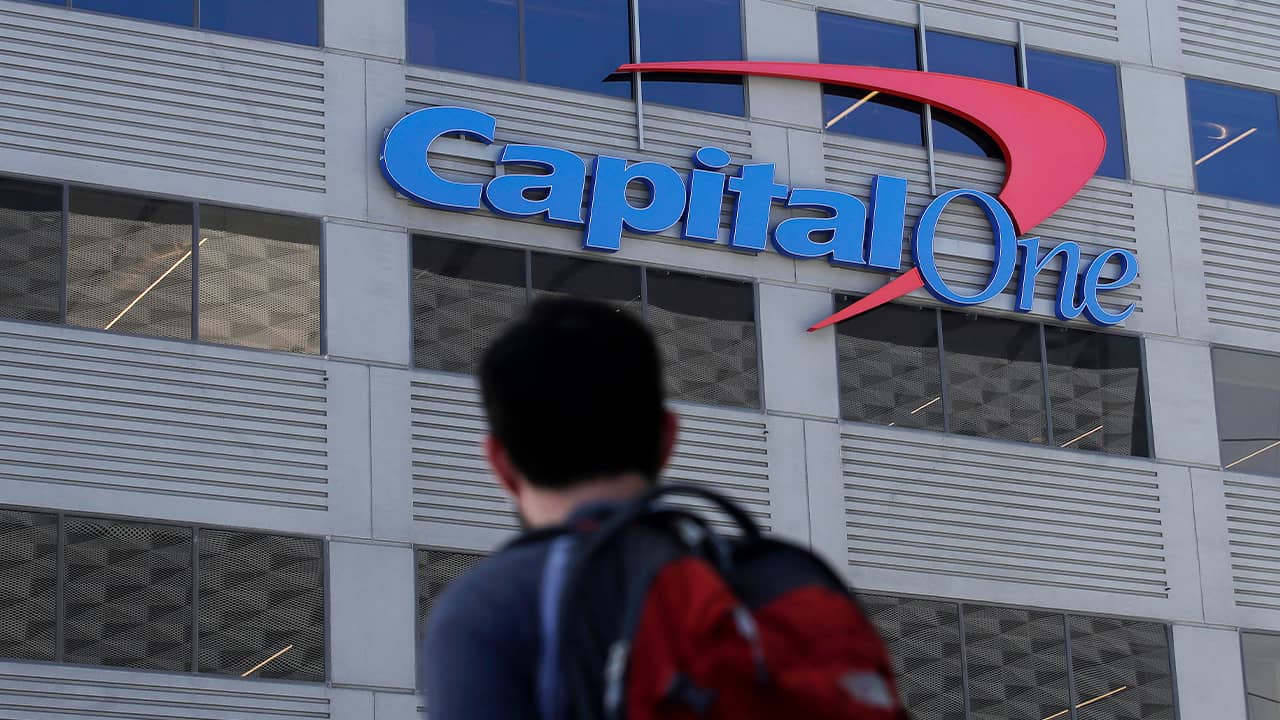 Photo of person standing in front of a Capitol One building in San Francisco