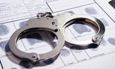 photo of handcuffs on a booking slip