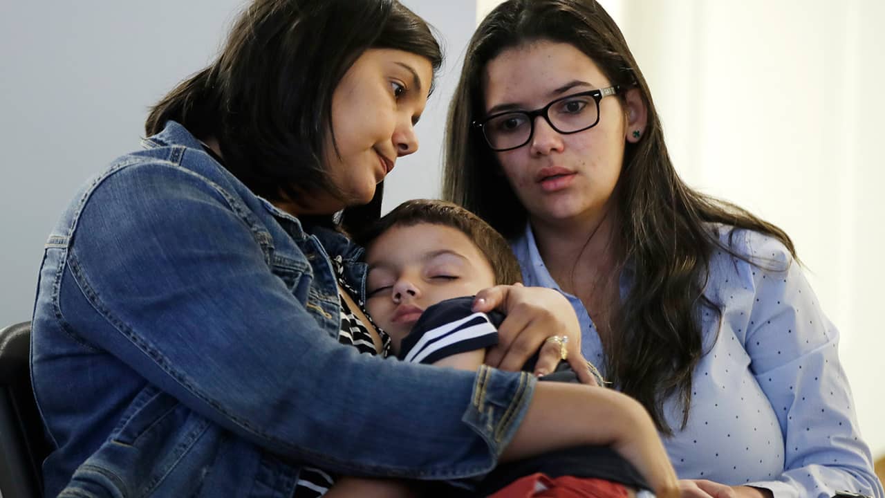 Photo of a woman holding her son