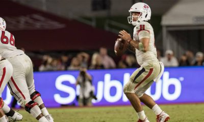 Photo of Fresno State quarterback Jorge Rena eyeing a receiver downfield against USC